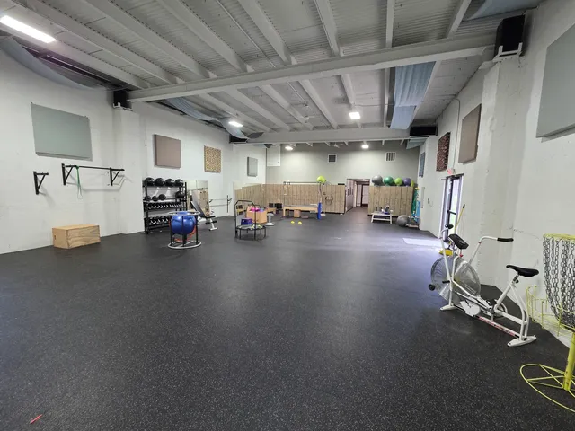 a view of a garage with wooden cabinets