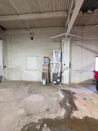 a room with furniture and next to a window
