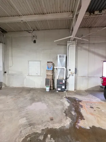 a room with furniture and next to a window