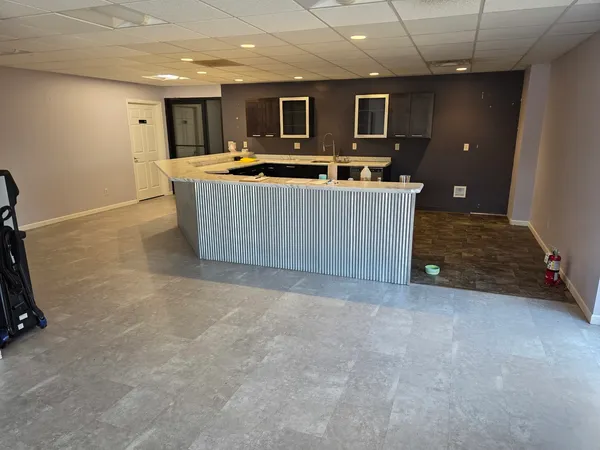 a kitchen with a sink and cabinets