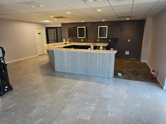 a kitchen with a sink and cabinets