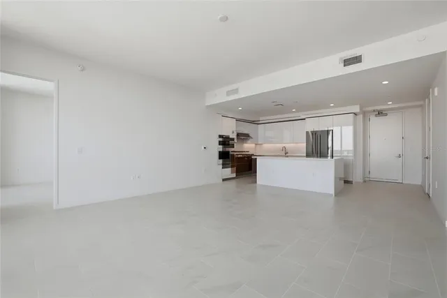 a bathroom with a glass shower door and a sink