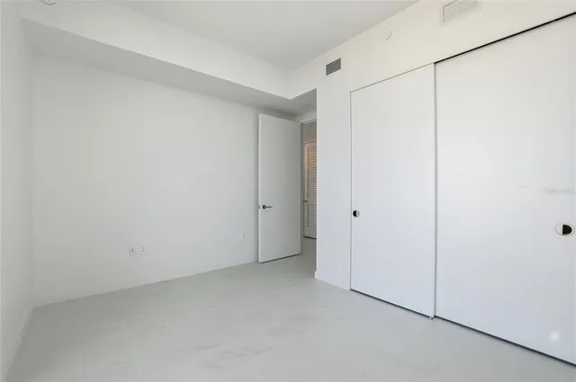 a bathroom with a shower and a sink