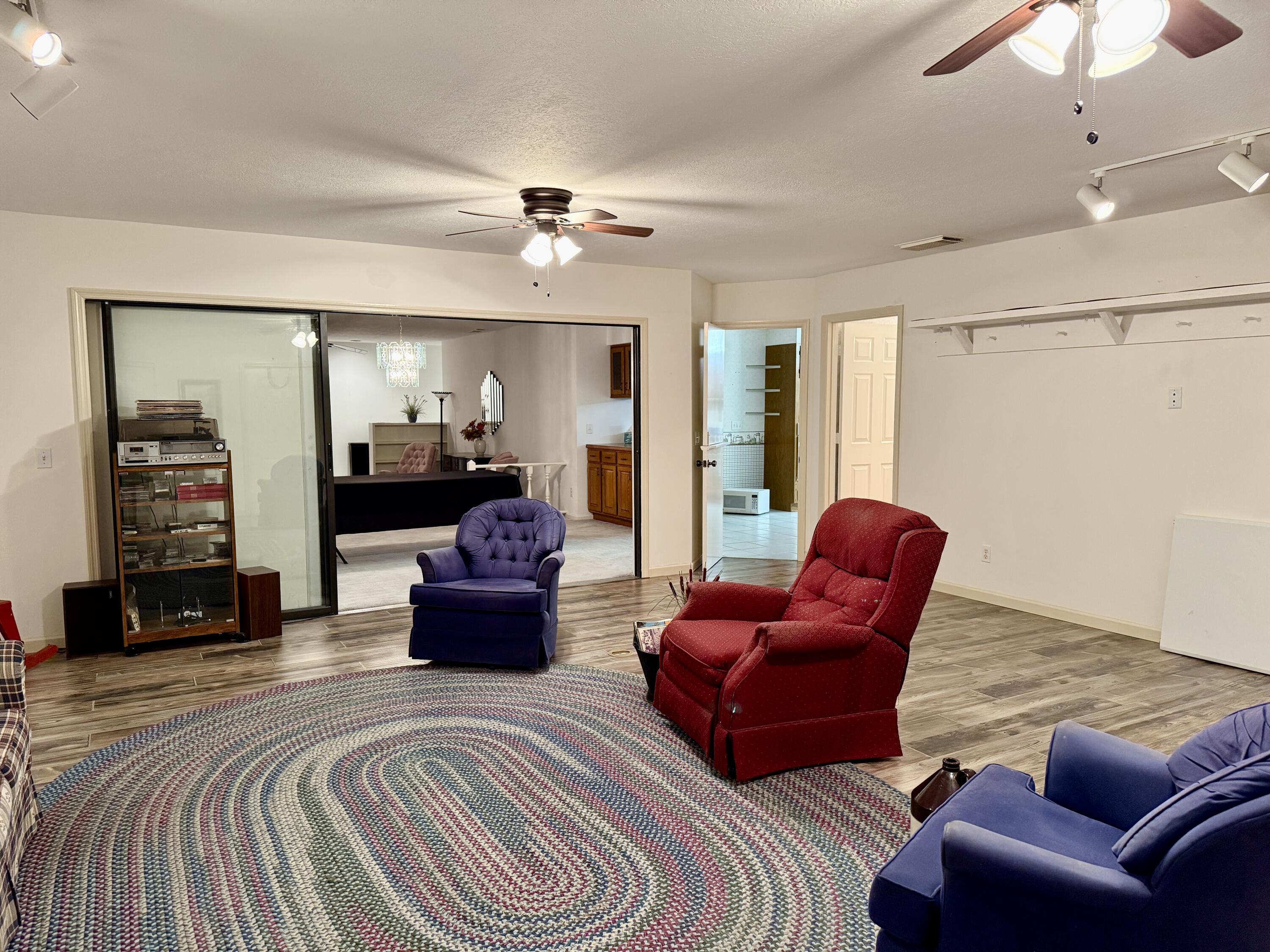 6539 Southeast Held Court Stuart, FL 34997 - Photo 11 of 34 a living room with furniture and wooden floor