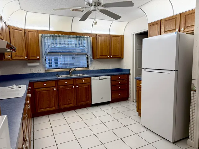 a kitchen with stainless steel appliances a refrigerator and a sink