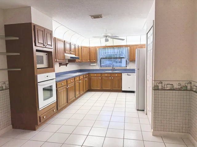 a kitchen with stainless steel appliances a sink and counter space