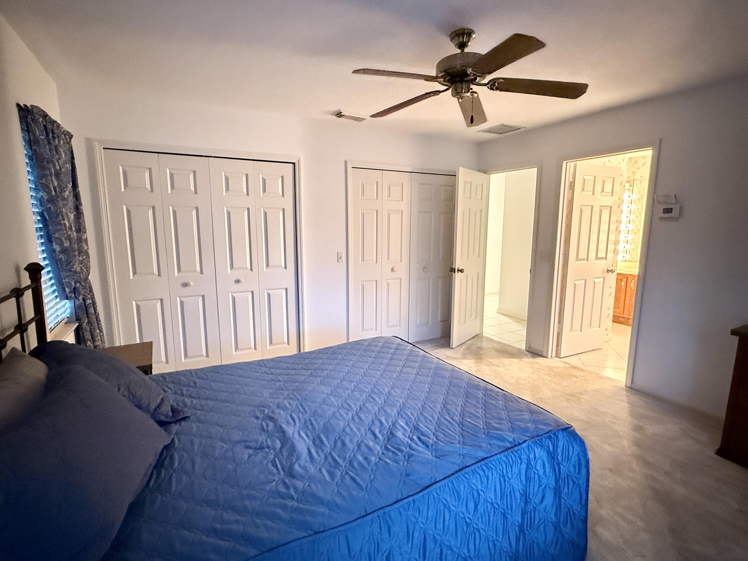 6539 Southeast Held Court Stuart, FL 34997 - Photo 19 of 34 a view of a livingroom with a ceiling fan and window