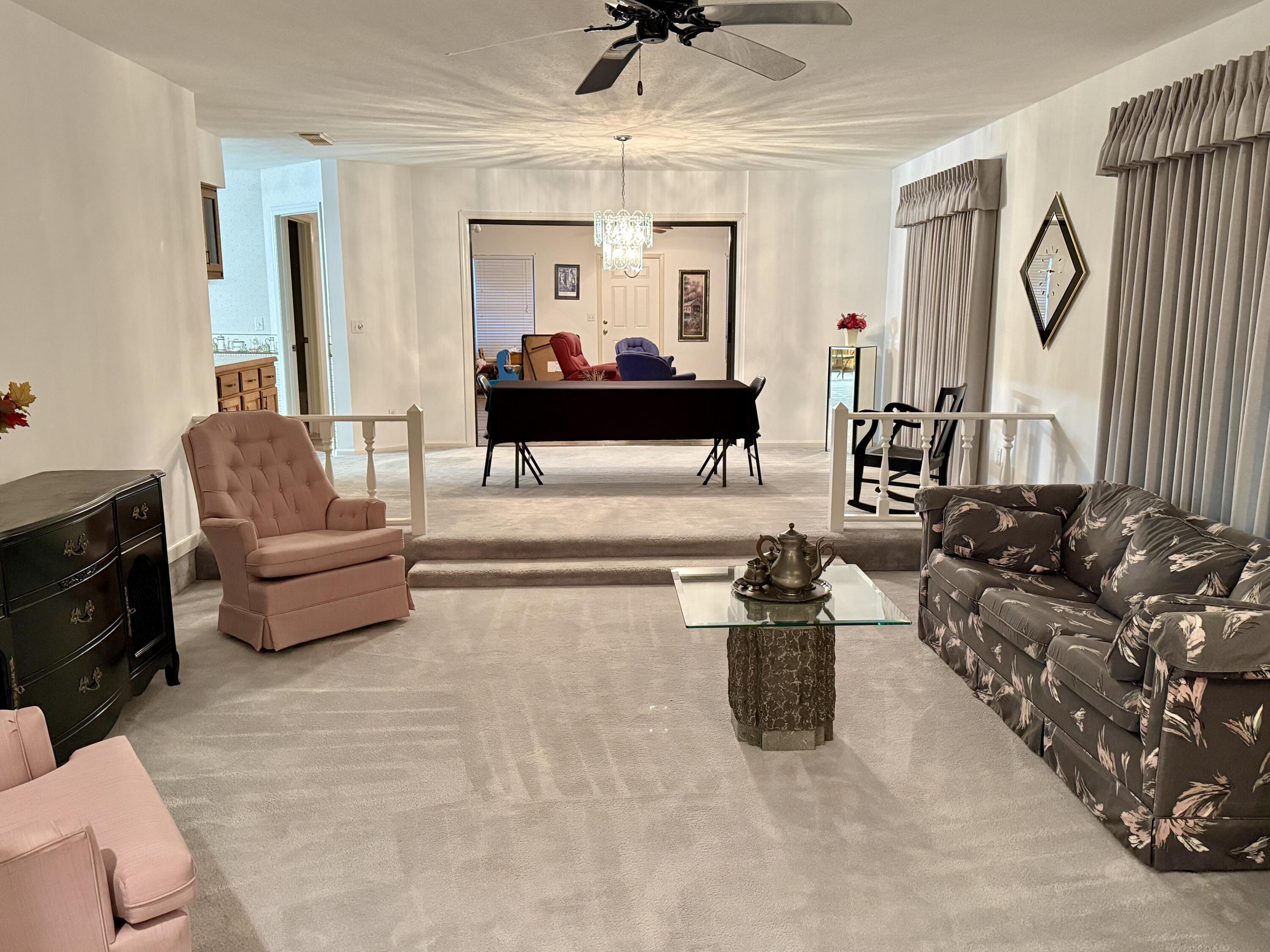 6539 Southeast Held Court Stuart, FL 34997 - Photo 6 of 34 a living room with furniture and a flat screen tv