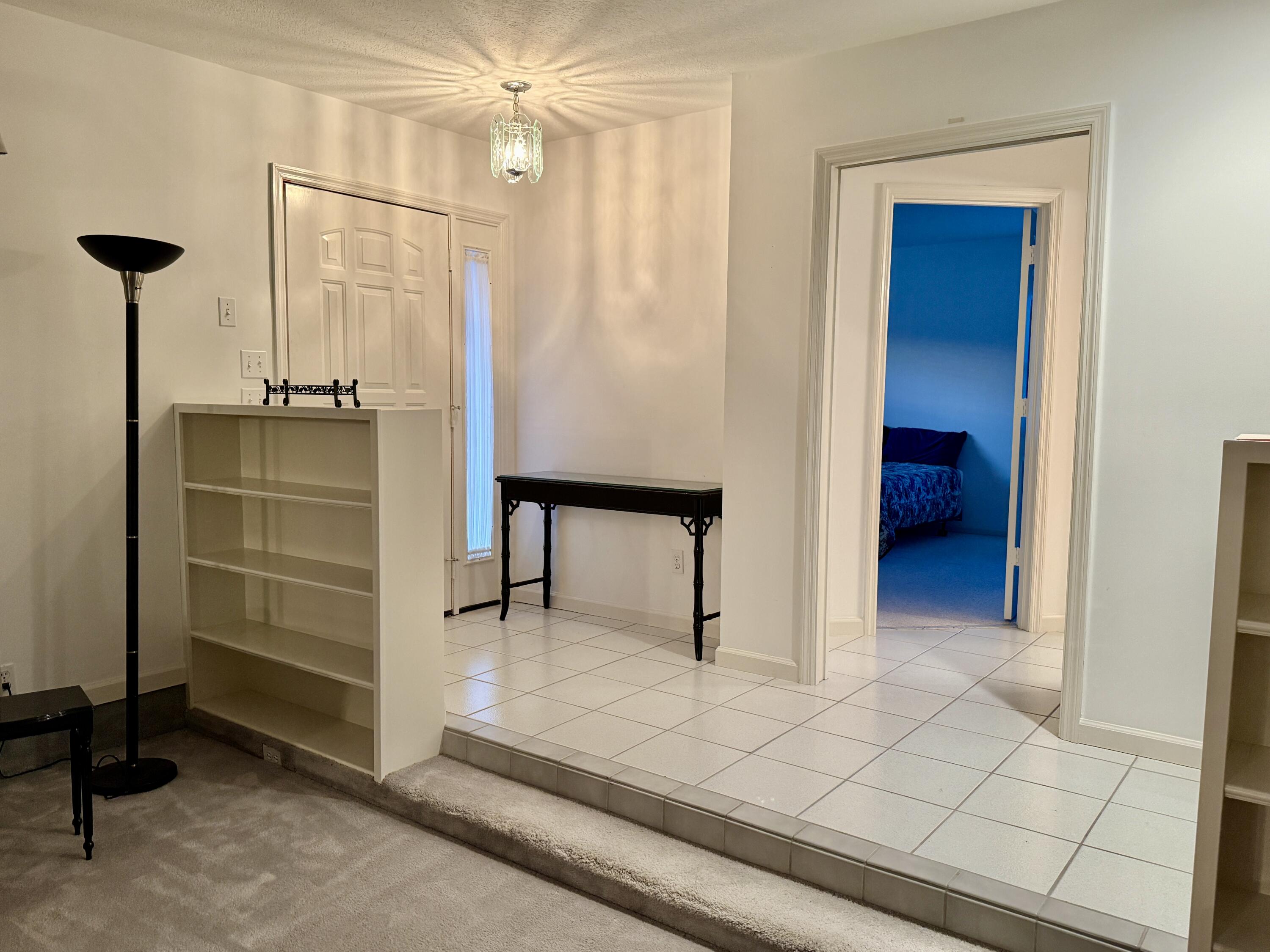 6539 Southeast Held Court Stuart, FL 34997 - Photo 9 of 34 a bathroom with a shower