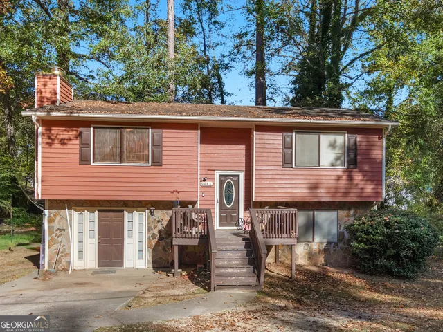 front view of a house with a tree