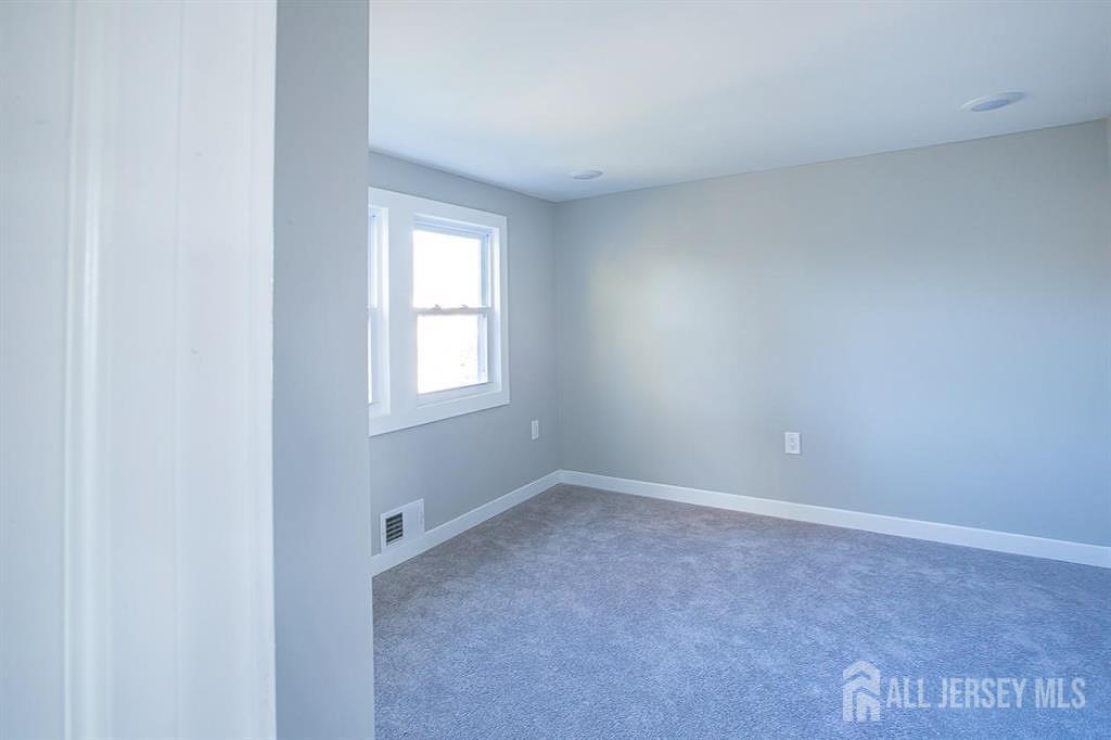213 Summerhill Road Spotswood, NJ 08884 - Photo 14 of 21 a view of an empty room with a window