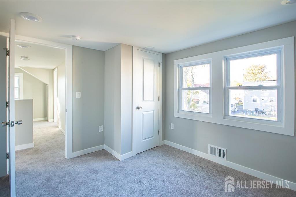 213 Summerhill Road Spotswood, NJ 08884 - Photo 15 of 21 a view of an empty room with a window