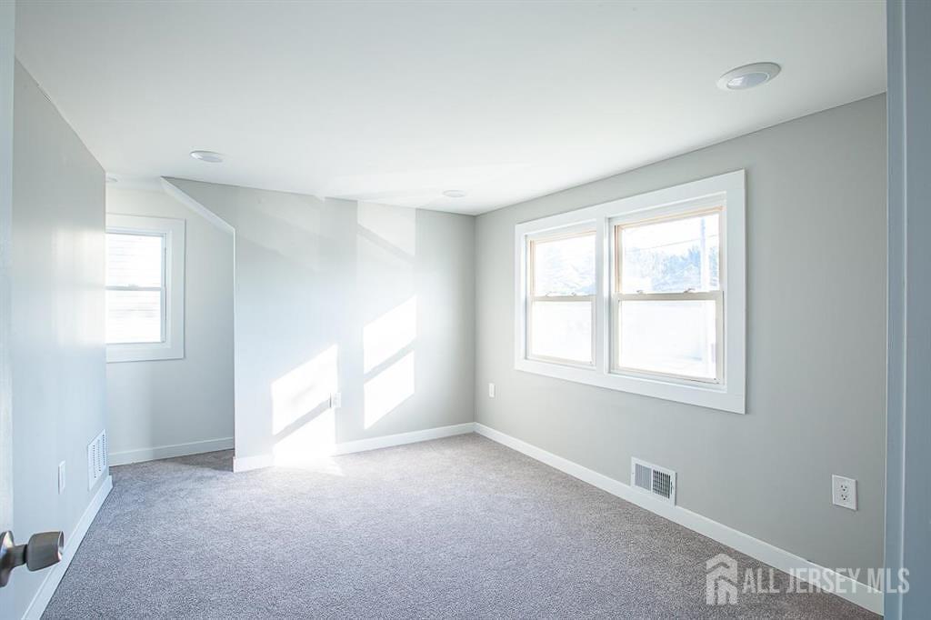 213 Summerhill Road Spotswood, NJ 08884 - Photo 16 of 21 an empty room with windows