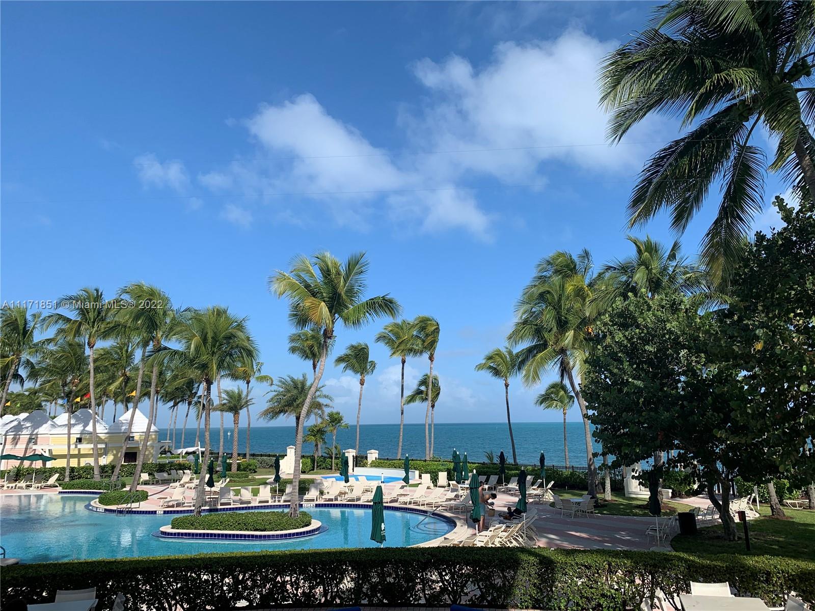 Key Biscayne Key Biscayne, FL 33149 - Photo 13 of 18 a view of a lake with a building in the background