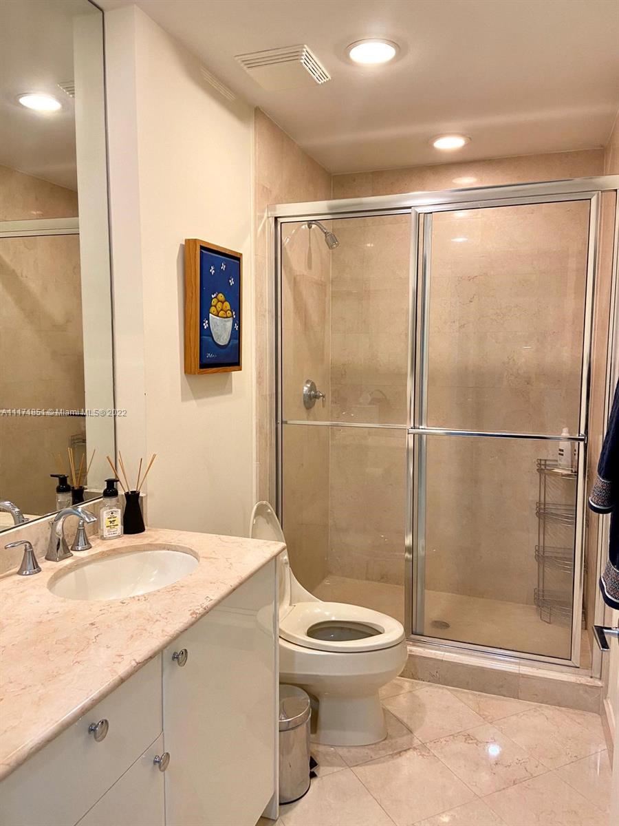 Key Biscayne Key Biscayne, FL 33149 - Photo 10 of 18 a bathroom with a granite countertop sink toilet and shower