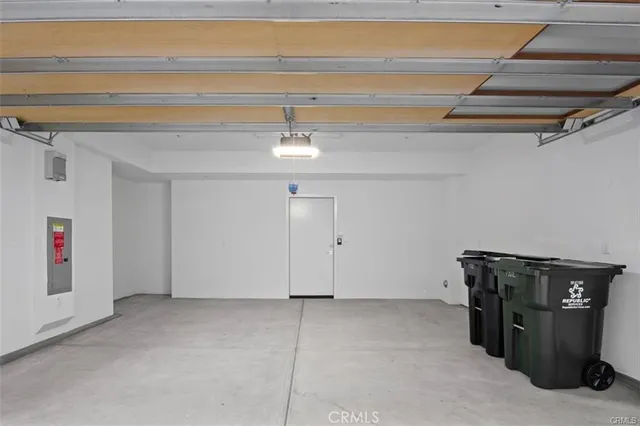 a view of a chair and table in the backyard