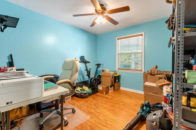 a bedroom with furniture and a window