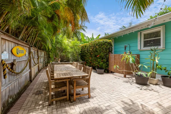 a view of a chairs and table in the patio