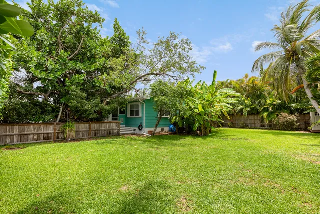 a view of a house with a yard porch and sitting area