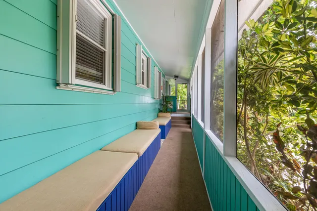 a balcony with painted walls and stairs