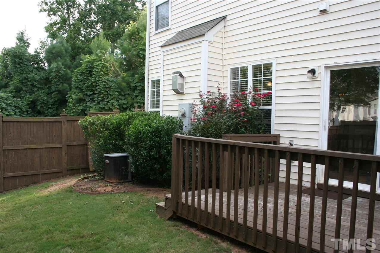 7727 Tanby Court Raleigh, NC 27613 - Photo 23 of 25 a view of a house with backyard and sitting area