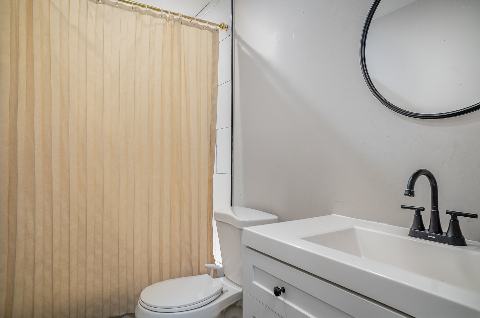 6226 Beechwood Road Matteson, IL 60443 - Photo 13 of 22 a bathroom with a sink vanity mirror and toilet