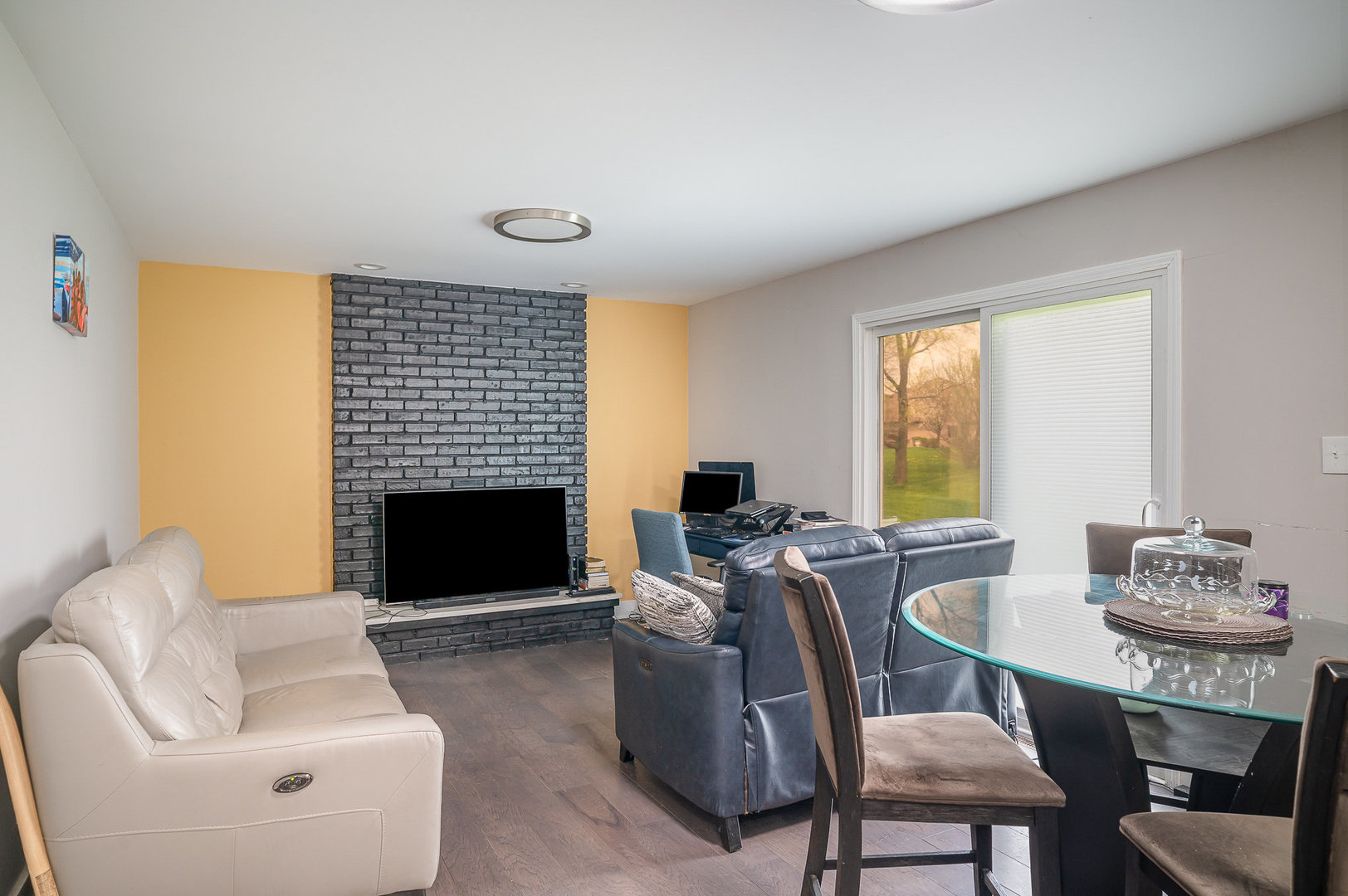 6226 Beechwood Road Matteson, IL 60443 - Photo 5 of 22 a living room with furniture a fireplace and a large window
