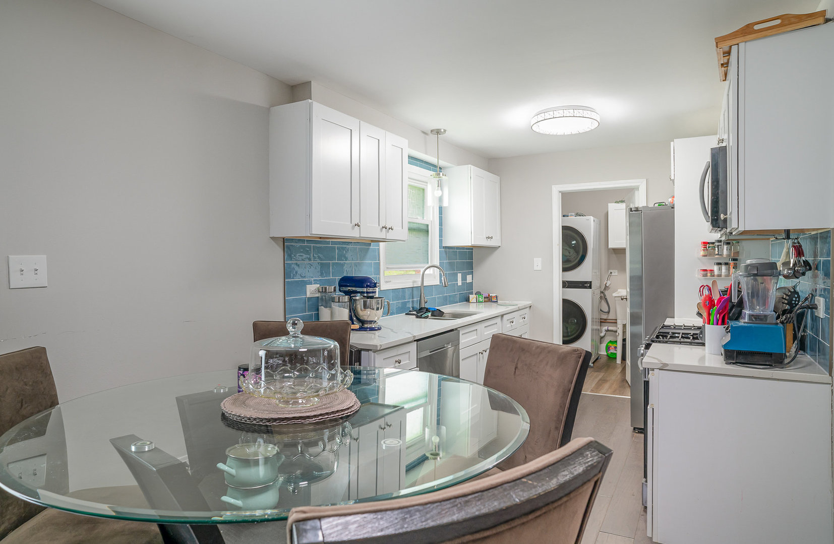 6226 Beechwood Road Matteson, IL 60443 - Photo 6 of 22 a kitchen with a dining table and chairs