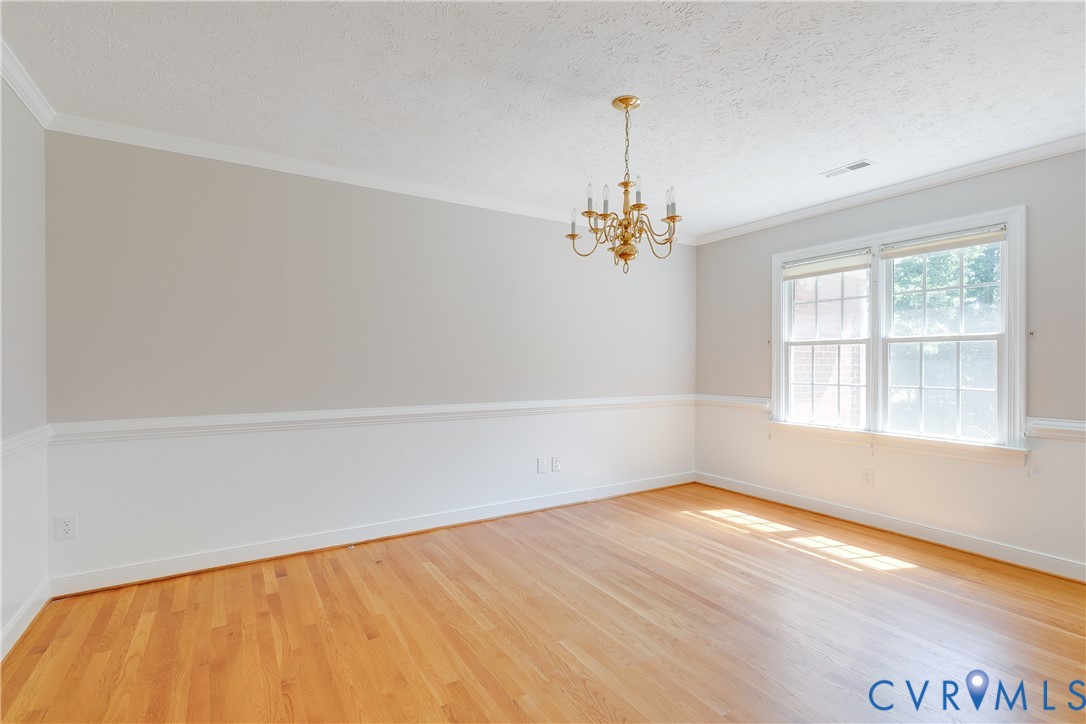 6701 Caboose Lane Sandston, VA 23150 - Photo 4 of 28 Elegant formal dining room featuring a classic cha