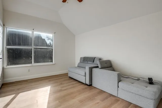 a living room with furniture and window