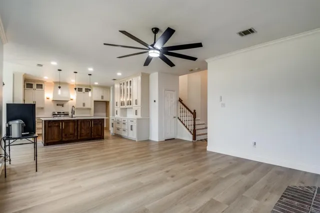 a view of kitchen with cabinets and wooden floor