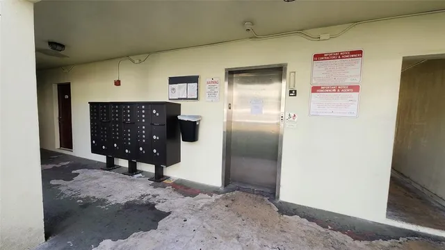 a view of a hallway with entryway door