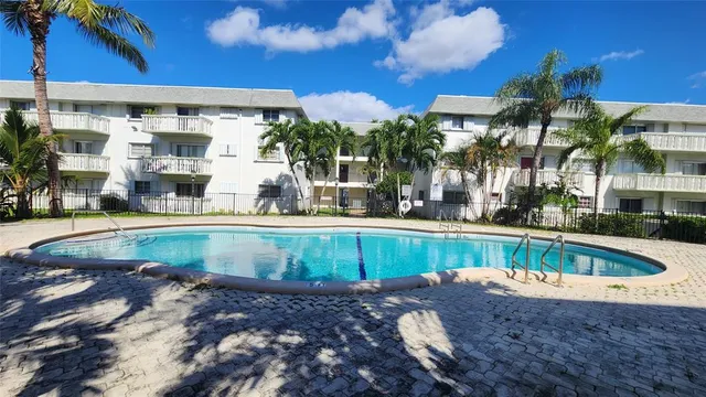 a view of a swimming pool with a patio