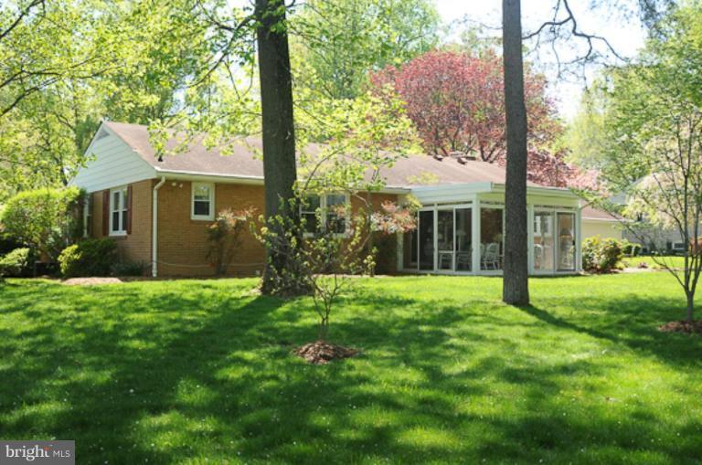205 Providence Road Annapolis, MD 21409 - Photo 14 of 20 a view of a house with yard and a garden