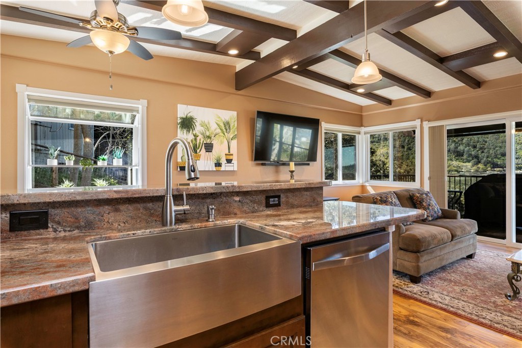 3103 Manzanita Road Kelseyville, CA 95451 - Photo 15 of 62 a dining hall with stainless steel appliances granite countertop a sink a counter space a large window and furniture