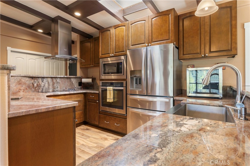 3103 Manzanita Road Kelseyville, CA 95451 - Photo 17 of 62 a kitchen with granite countertop a refrigerator and a sink