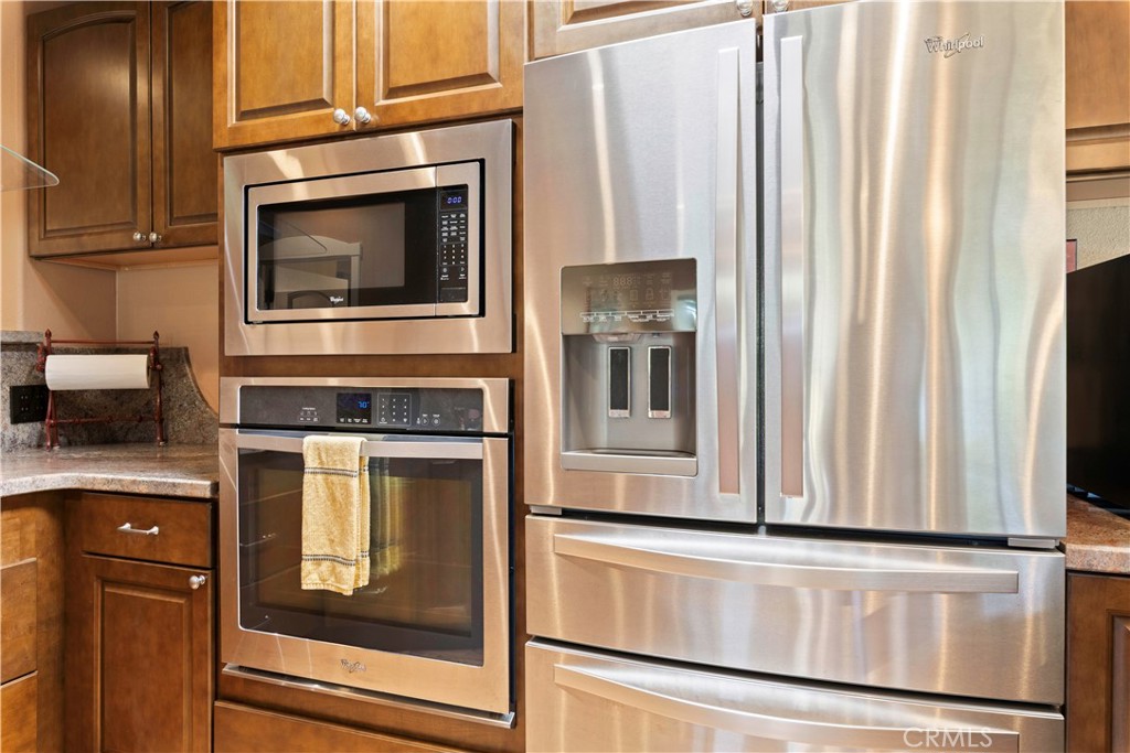 3103 Manzanita Road Kelseyville, CA 95451 - Photo 23 of 62 a kitchen with granite countertop white cabinets and stainless steel appliances