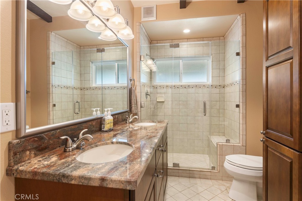 3103 Manzanita Road Kelseyville, CA 95451 - Photo 35 of 62 a bathroom with a sink a toilet and shower