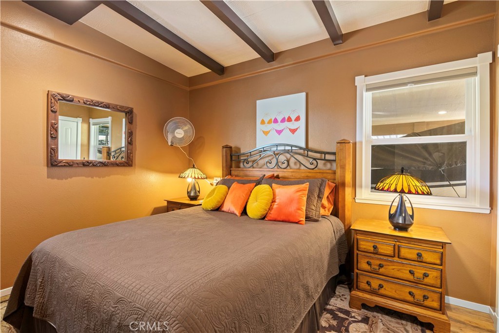 3103 Manzanita Road Kelseyville, CA 95451 - Photo 39 of 62 a bedroom with a bed and a lamp on the dresser
