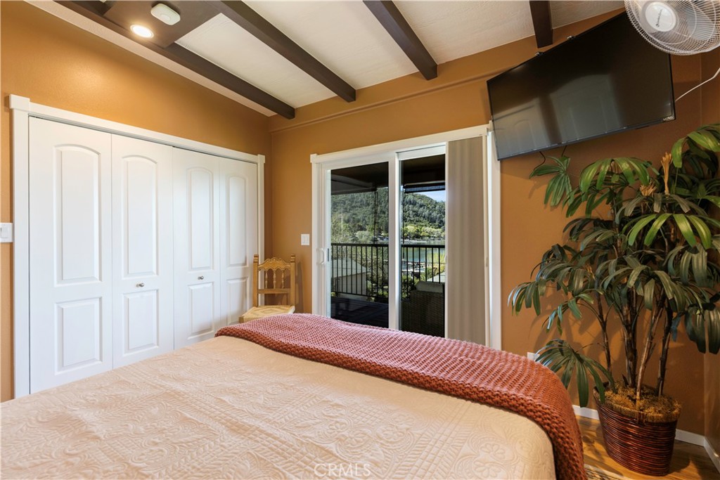 3103 Manzanita Road Kelseyville, CA 95451 - Photo 40 of 62 a bedroom with a bed and a potted plant