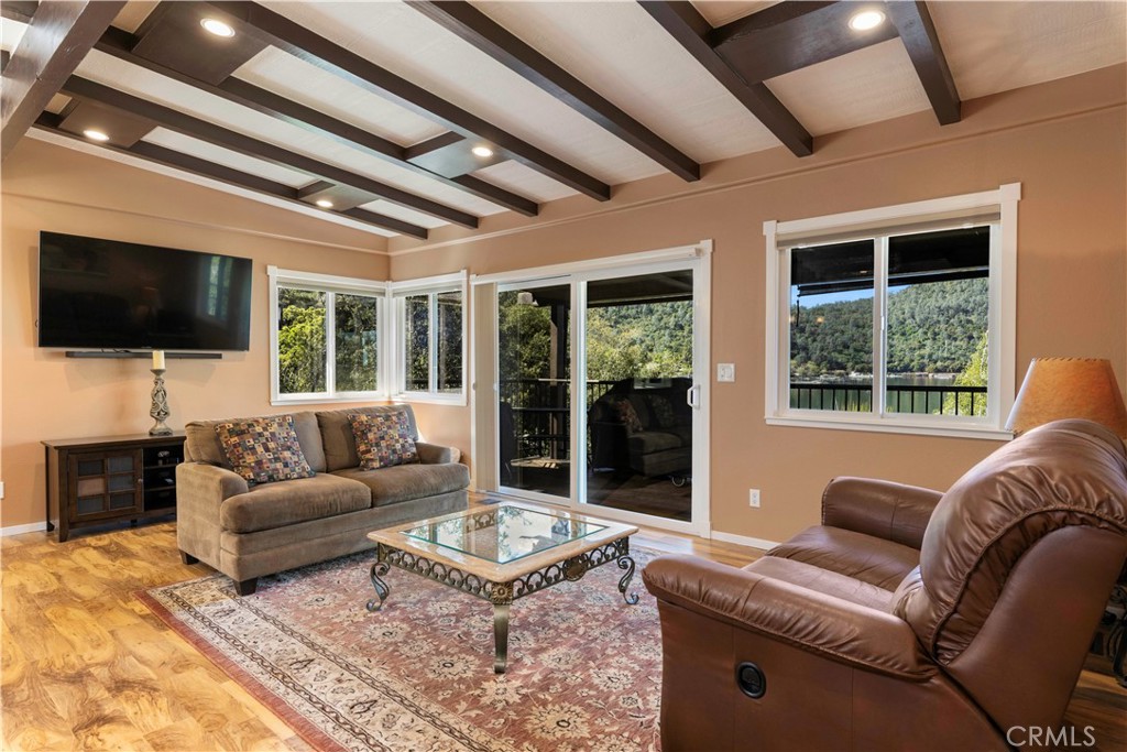 3103 Manzanita Road Kelseyville, CA 95451 - Photo 4 of 62 a living room with furniture a flat screen tv and a large window