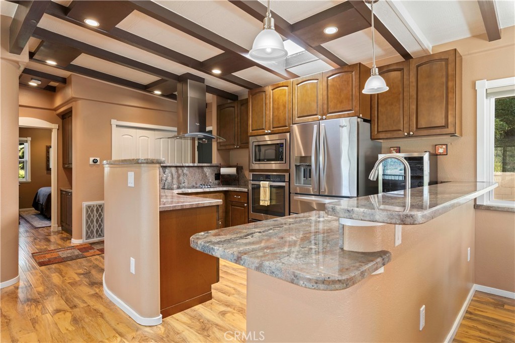 3103 Manzanita Road Kelseyville, CA 95451 - Photo 10 of 62 a kitchen with stainless steel appliances granite countertop a refrigerator and a sink