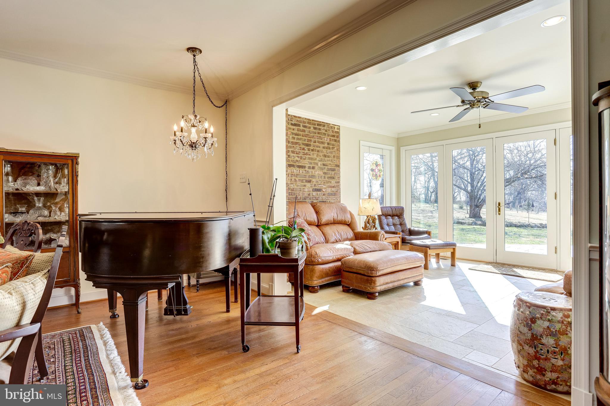 40445 Beechnut Road Leesburg, VA 20175 - Photo 16 of 42 Living Room Design Opens to Light-Flooded Sunroom