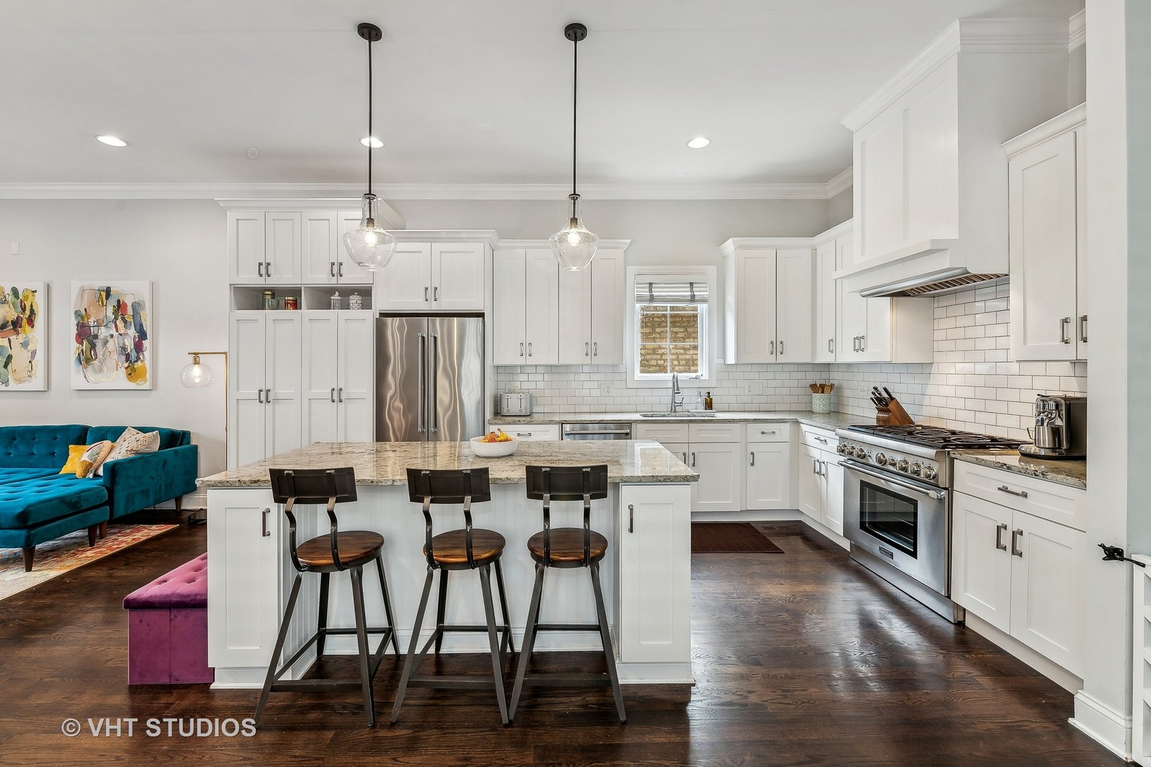 3409 North Ridgeway Avenue Chicago, IL 60618 - Photo 14 of 37 a kitchen with stainless steel appliances kitchen island granite countertop a stove a sink dishwasher and a refrigerator with wooden floor