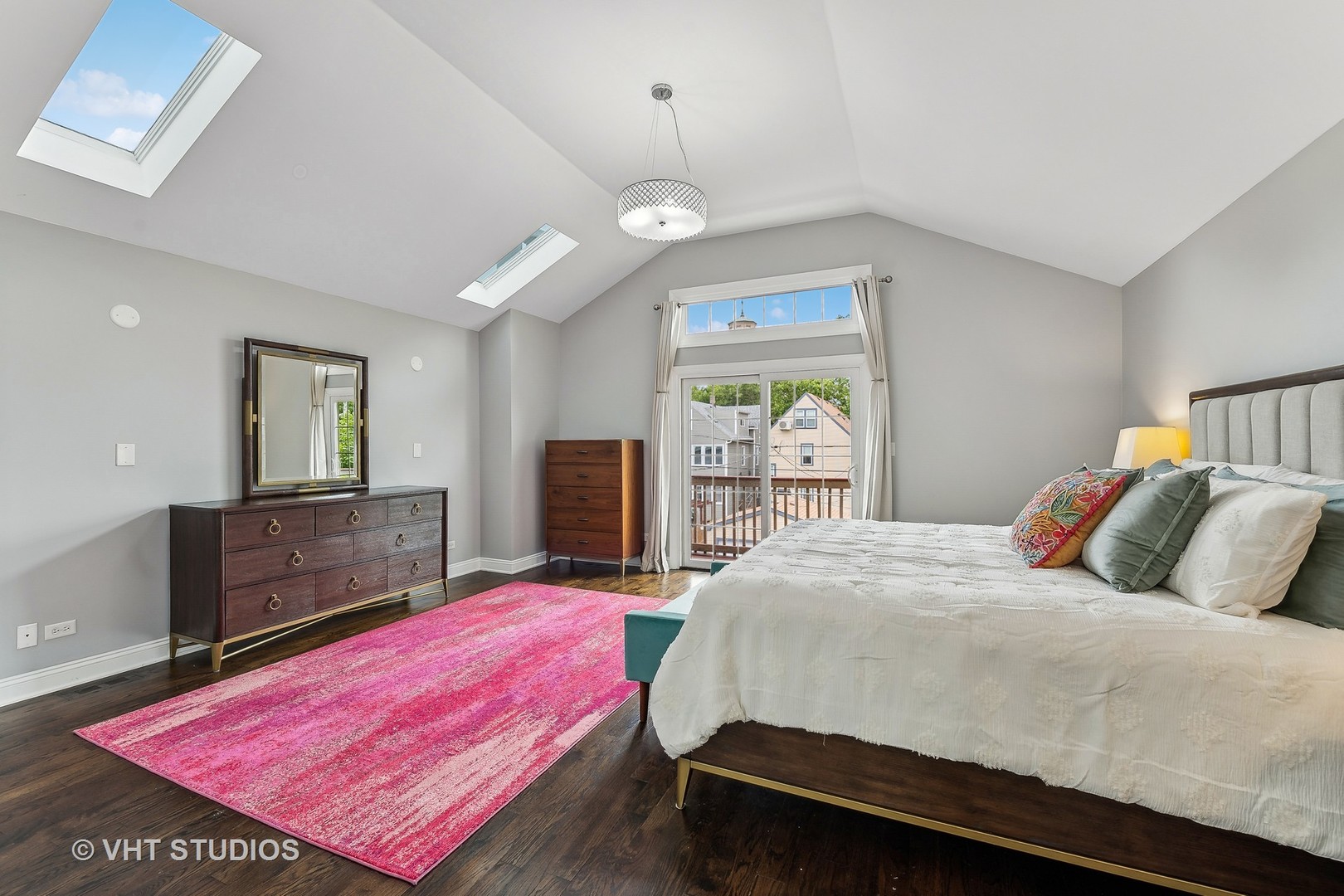 3409 North Ridgeway Avenue Chicago, IL 60618 - Photo 19 of 37 a bedroom with a bed and dresser with mirror