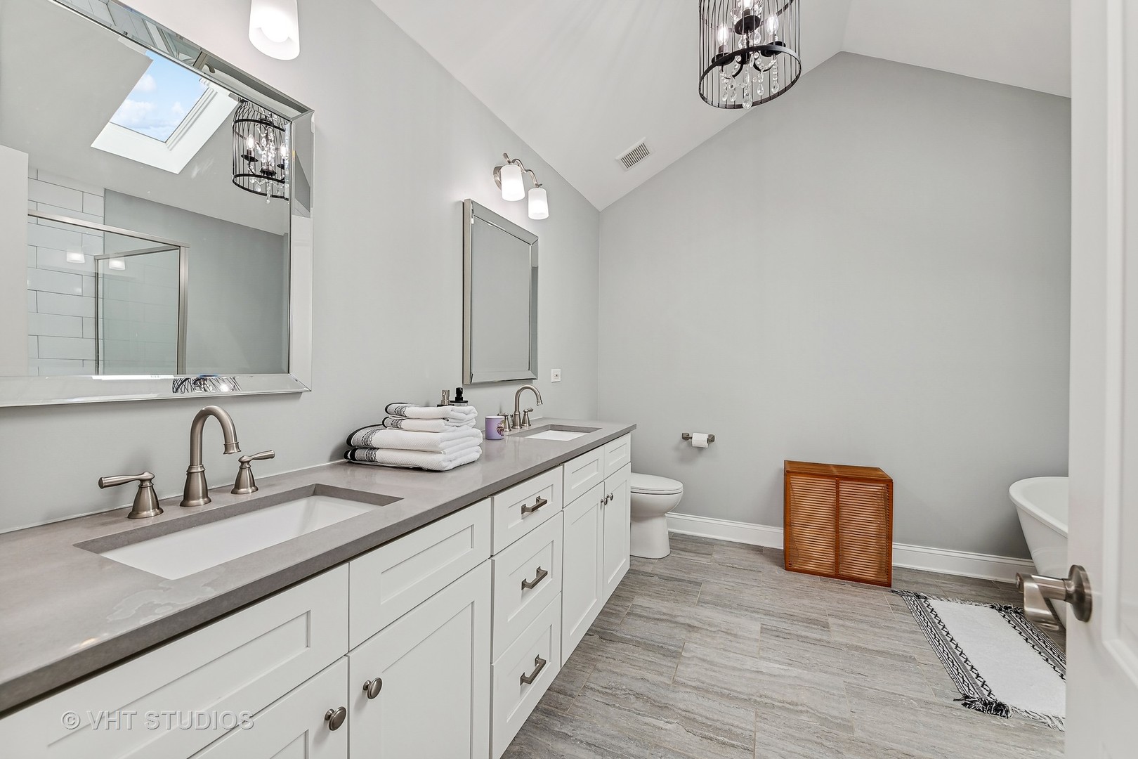 3409 North Ridgeway Avenue Chicago, IL 60618 - Photo 21 of 37 a spacious bathroom with a double vanity sink and a mirror