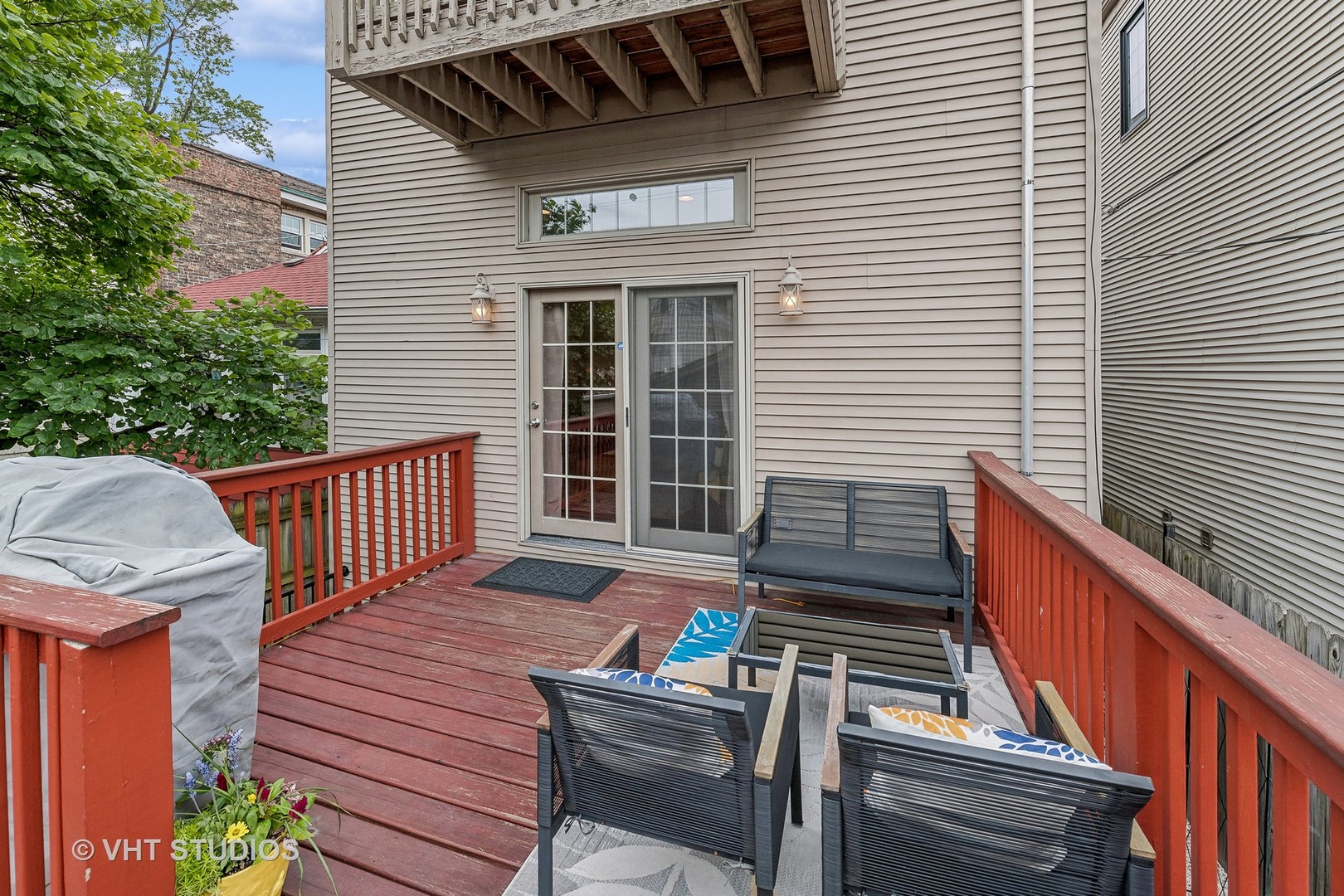 3409 North Ridgeway Avenue Chicago, IL 60618 - Photo 31 of 37 a view of a deck with wooden floor and a chairs