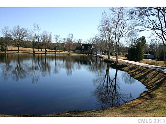 3458 Flat Creek Road Lancaster, SC 29720 - Photo 1 of 8 a view of a lake with houses with outdoor space
