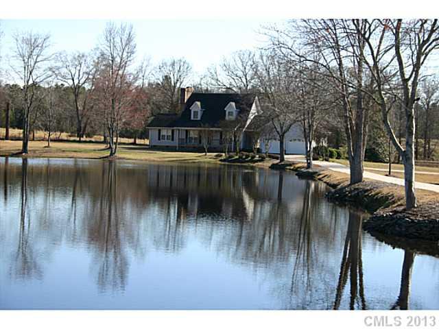 3458 Flat Creek Road Lancaster, SC 29720 - Photo 2 of 8 a swimming pool view with a lake view