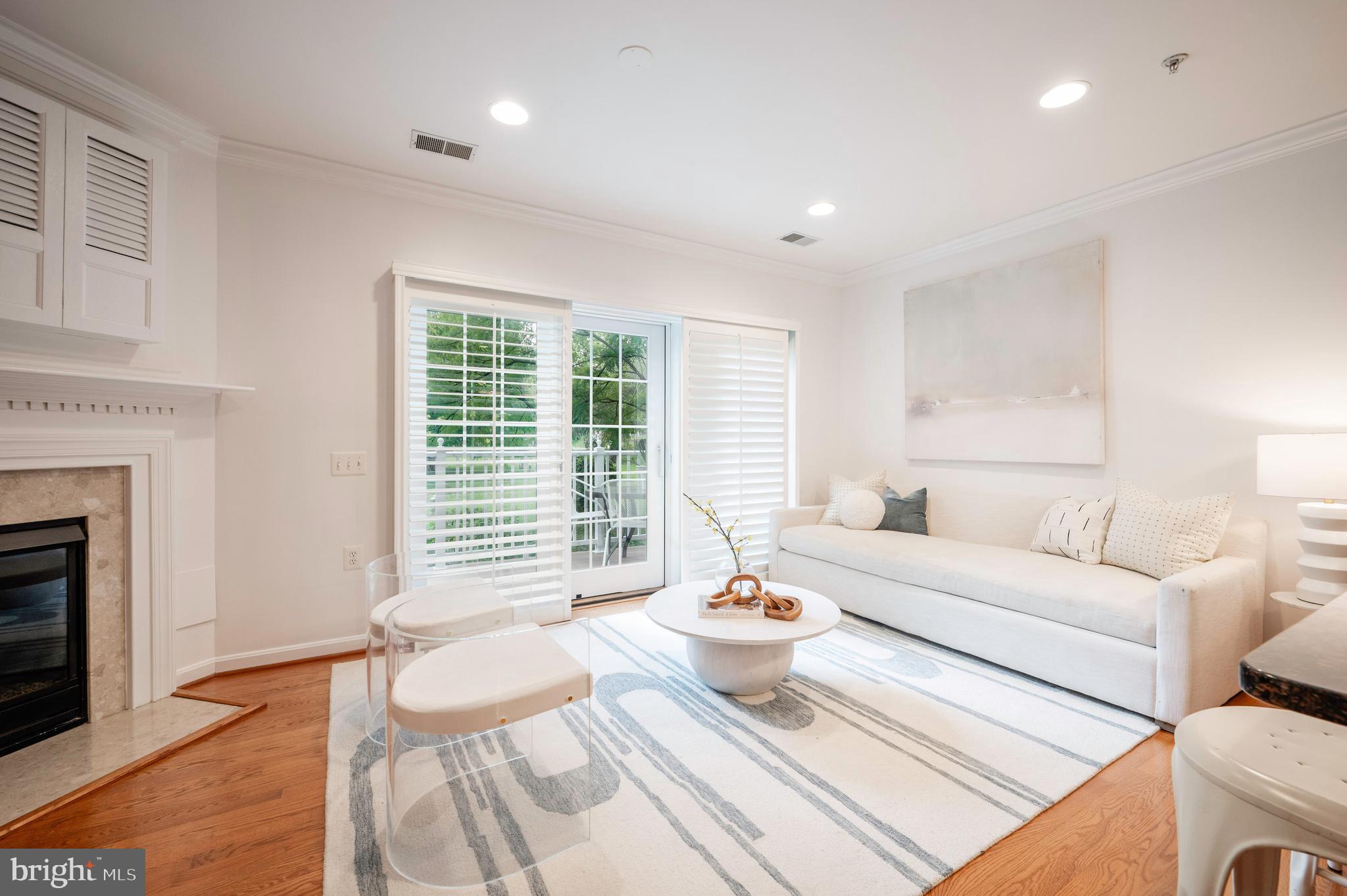1422 Roundhouse Lane, Unit 1422 Alexandria, VA 22314 - Photo 13 of 73 a living room with furniture and a fireplace